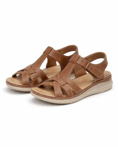 Women’s flat sandals with criss-cross straps, adjustable ankle strap, and wedge sole